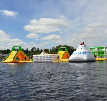 Baysports inflatable waterpark in the river with slides and climbing frames