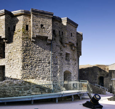 Athlone Castle interior with stone turret and glass walkway