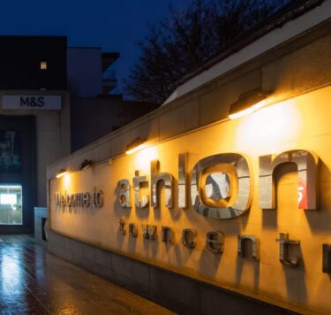 Front view of Athlone Town centre with signage and front door.