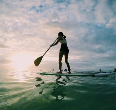 Lady paddleboarding in the water on Lough Ree