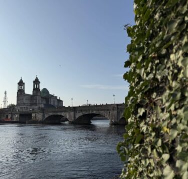Riverside view of the main bridge in Athlone with St Peter & Paul's Church in the background